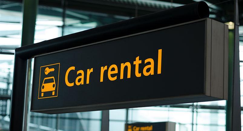 Car rental sign at an airport