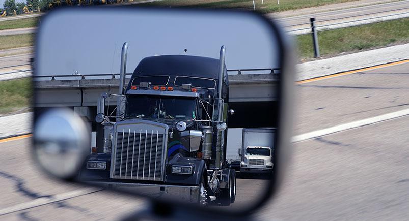 Semi truck in a mirror