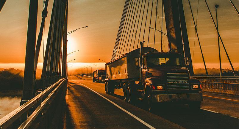 Trucking company vehicle on a bridge