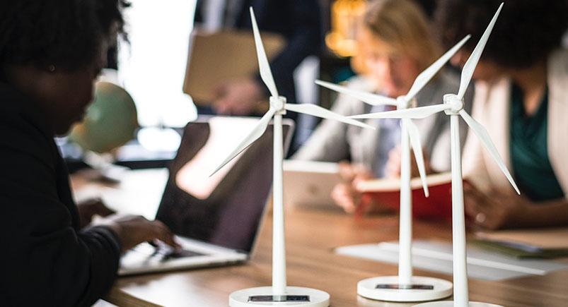 how-small-business-helping-the-environment_windmills-environment_rawpixel Managers of a small business working
