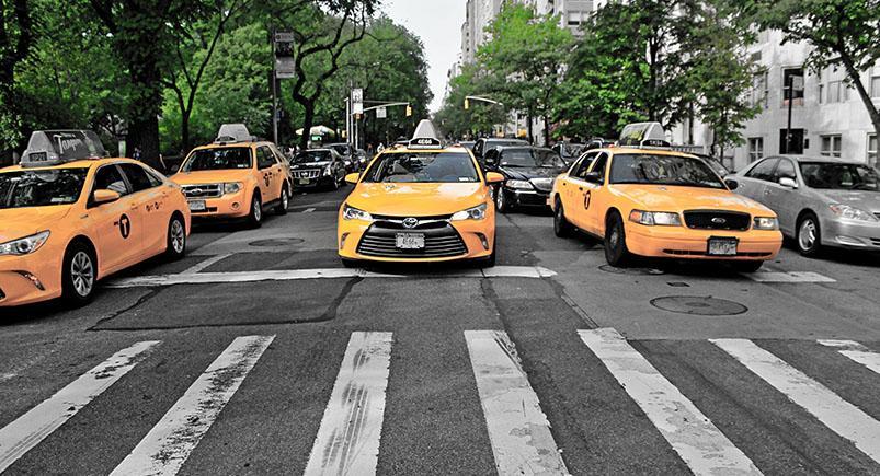 Yellow taxi cabs on the road