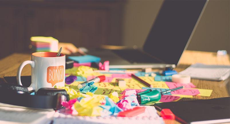 can-eliminating-clutter-make-your-workforce-better_messy-desk-comet-suite_ferenc-horvath A cluttered desk