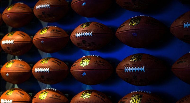 Footballs on a shelf