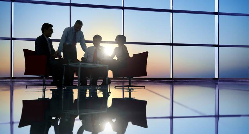 Group of Business People Meeting in Back Lit Corporate employees in an office