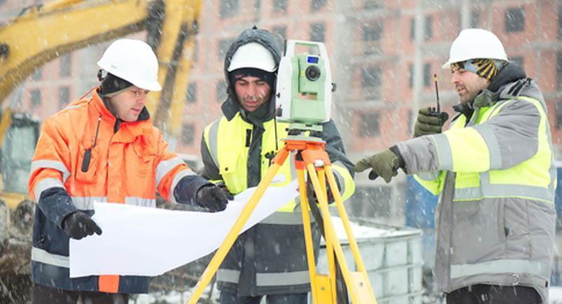 A civil engineering crew conducting an inspection in the field