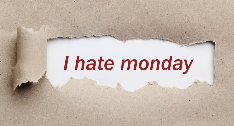 Torn brown paper, for text, close up Torn piece of paper with the word "Monday"