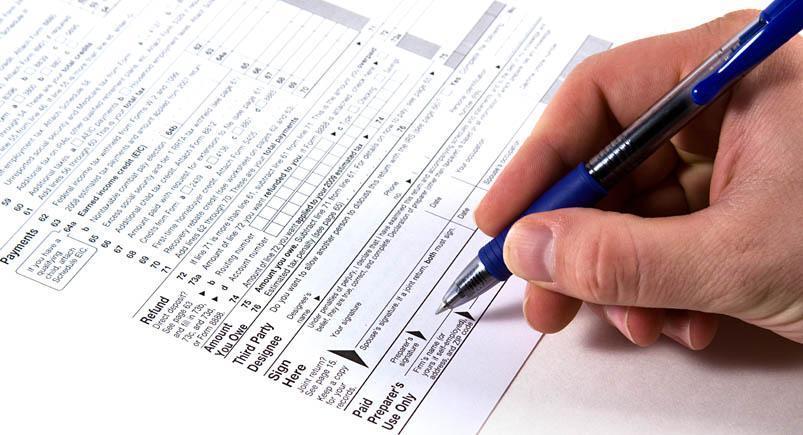 Preparing Taxes Completing paperwork by hand