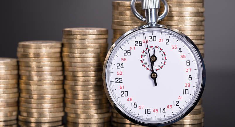 Time and money growth Coins and a stopwatch