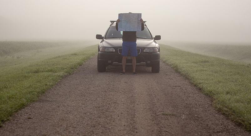 Driver reading a map