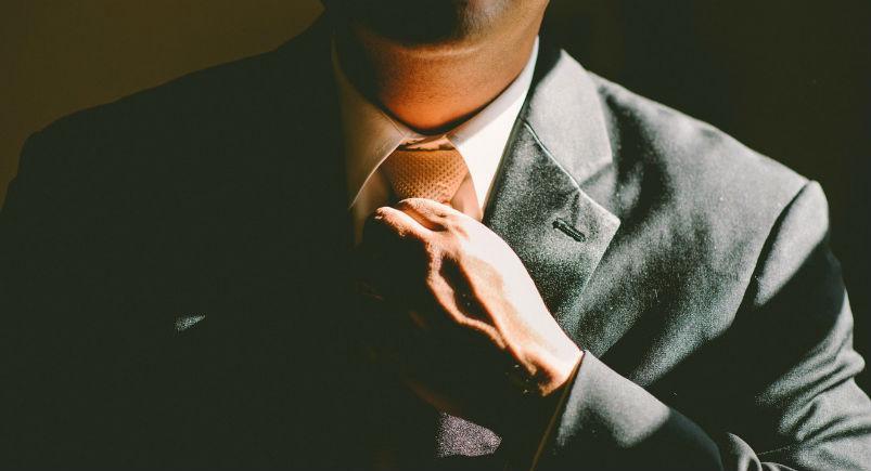 sales-pitch Salesman adjusting tie