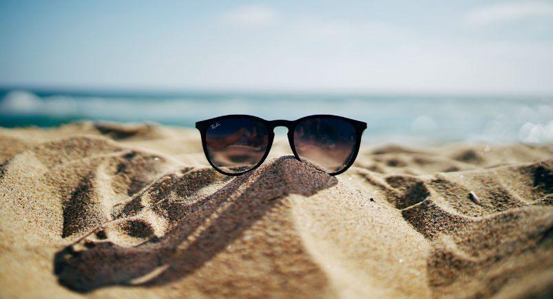 sunglasses-summer-vacation Sunglasses on a beach