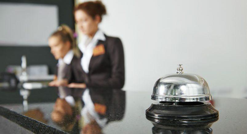 Hotel receptionists at a front desk