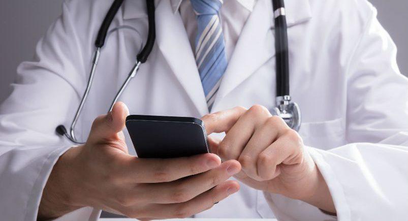 Healthcare professional using a mobile device