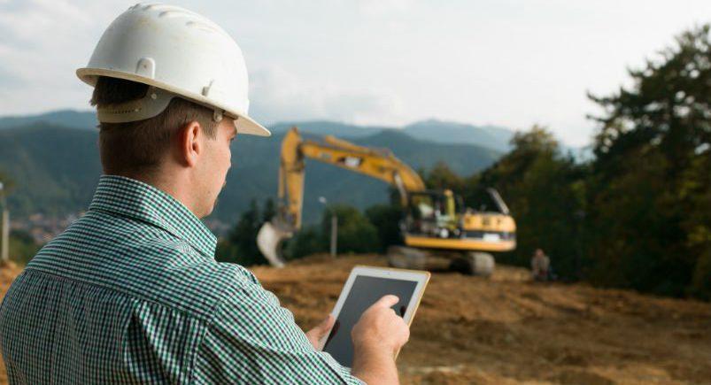 Construction worker conducting safety checks