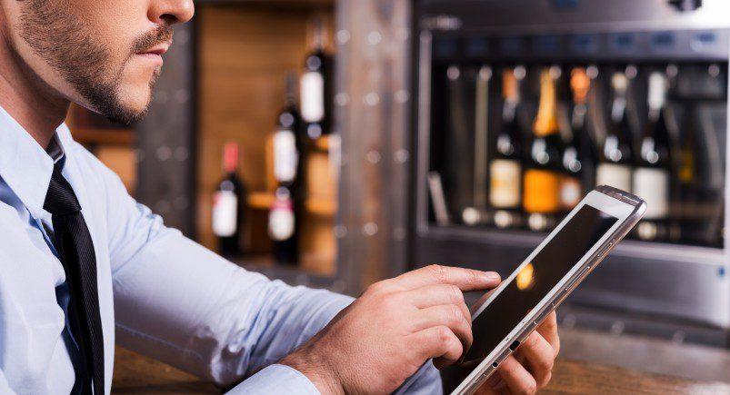 man-with-tablet-restaurant Restaurant employee using tablet device