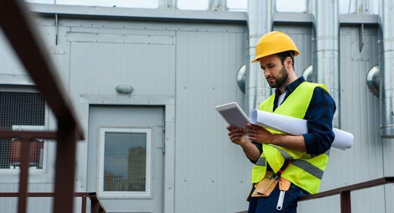 Construction engineer reviewing instructions