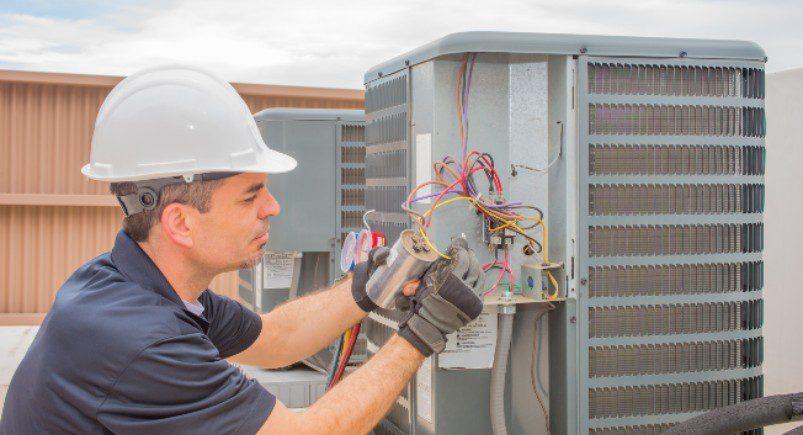 HVAC technician completing a work order
