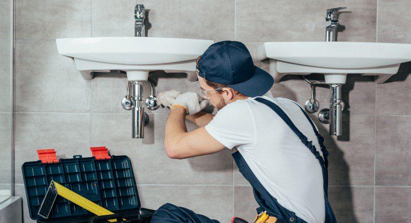Plumbing employee completing a service request