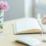 Book and reading glasses on a desk