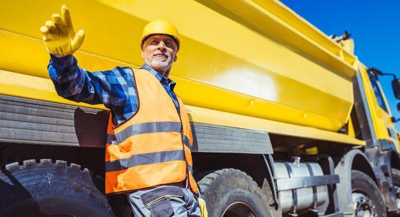 Construction worker directing vehicles