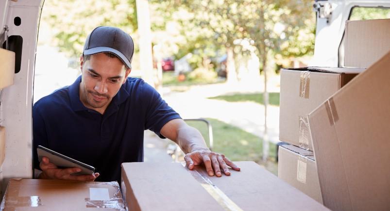 Courier delivery driver checking Mobile Workforce Plus on tablet for dispatched orders set in Google Calendar