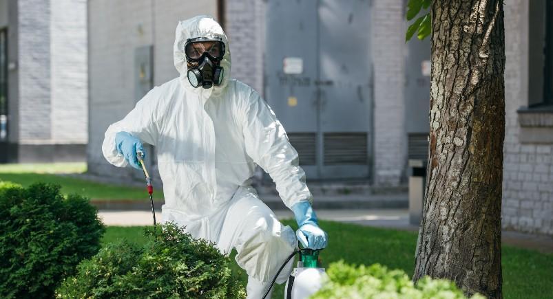 Pest control employee working at a commercial business