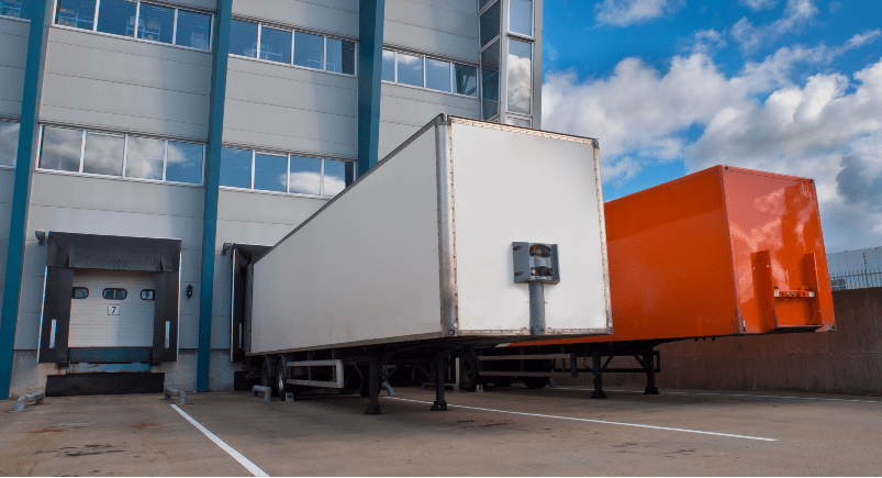 Trailers being loaded with goods at a warehouse