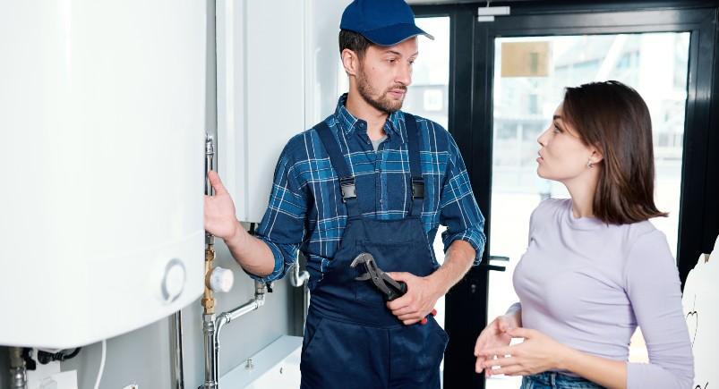 Property manager and plumbing contractor discussing service history notes, imported to Mobile Workforce Plus through Google Sheets