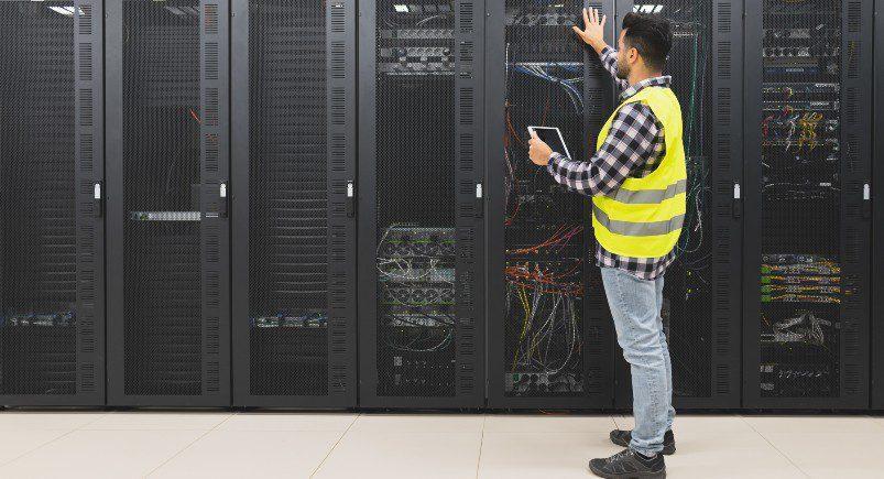 IT employee working in server room after receiving order in Mobile Workforce Plus