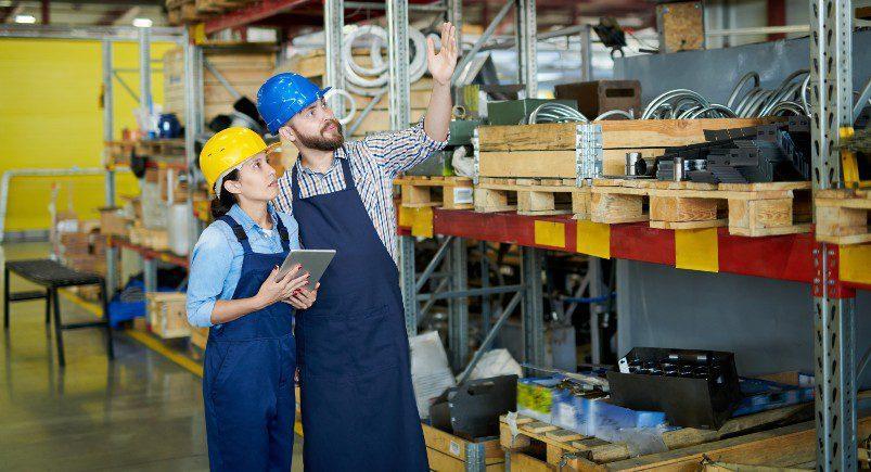 Warehouse workers using our platform for inventory management