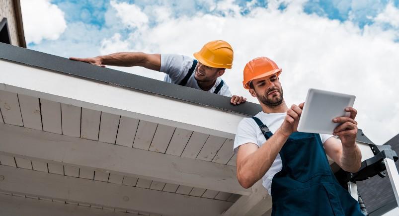 Roofers completing a project