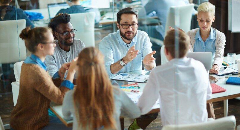 Employees discussing projects and effective time management