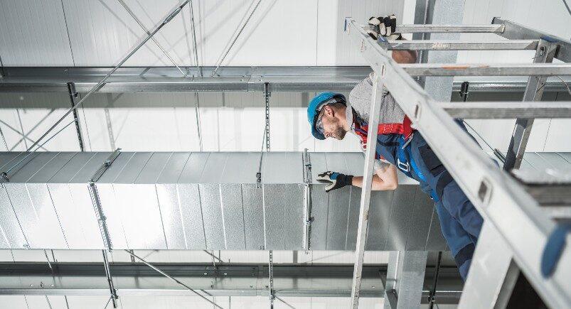 HVAC employee working on ventilation