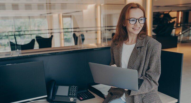 A business owner using a computer to create employee schedules