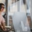 An office employee scheduling jobs for field technicians