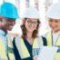 A team of architects using construction management software